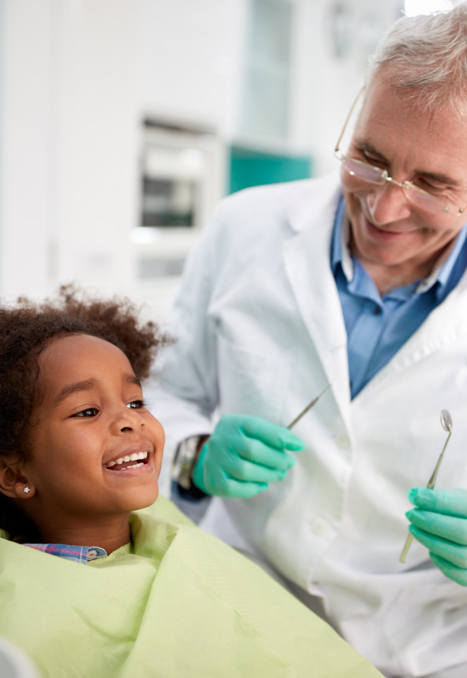 child smiling at dentist