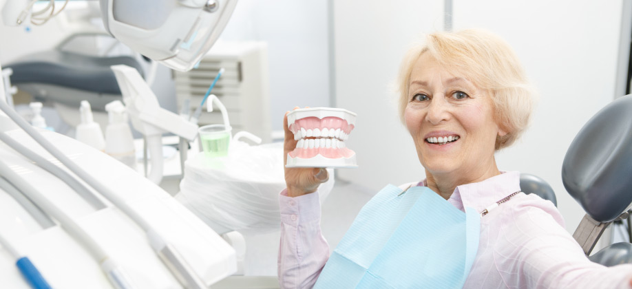 elderly lady smiling with teeth diorama