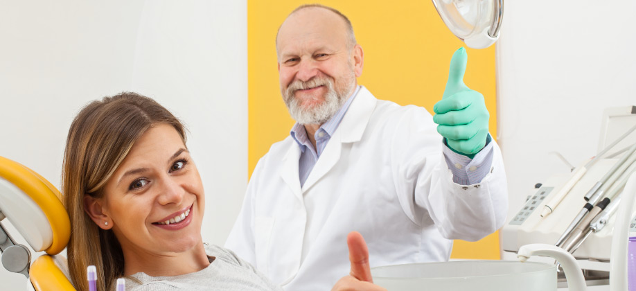 dentist and patient giving thumbs up