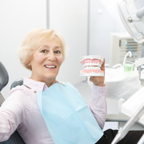 elderly lady smiling with teeth diorama
