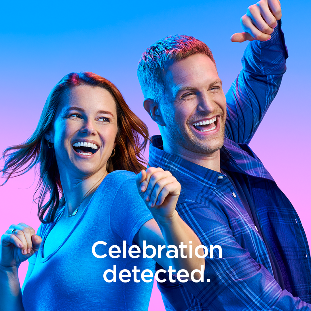 Couple smiling happy dancing together in celebration