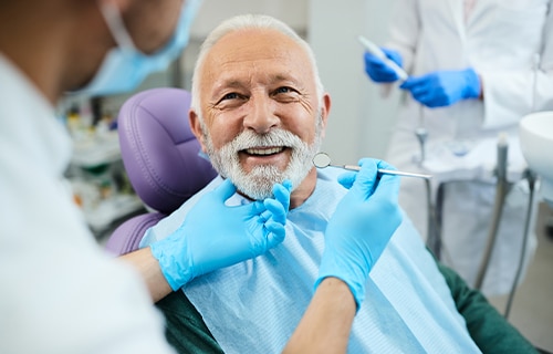 man sitting in dental chair