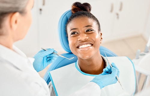 woman smiling in dentist chair